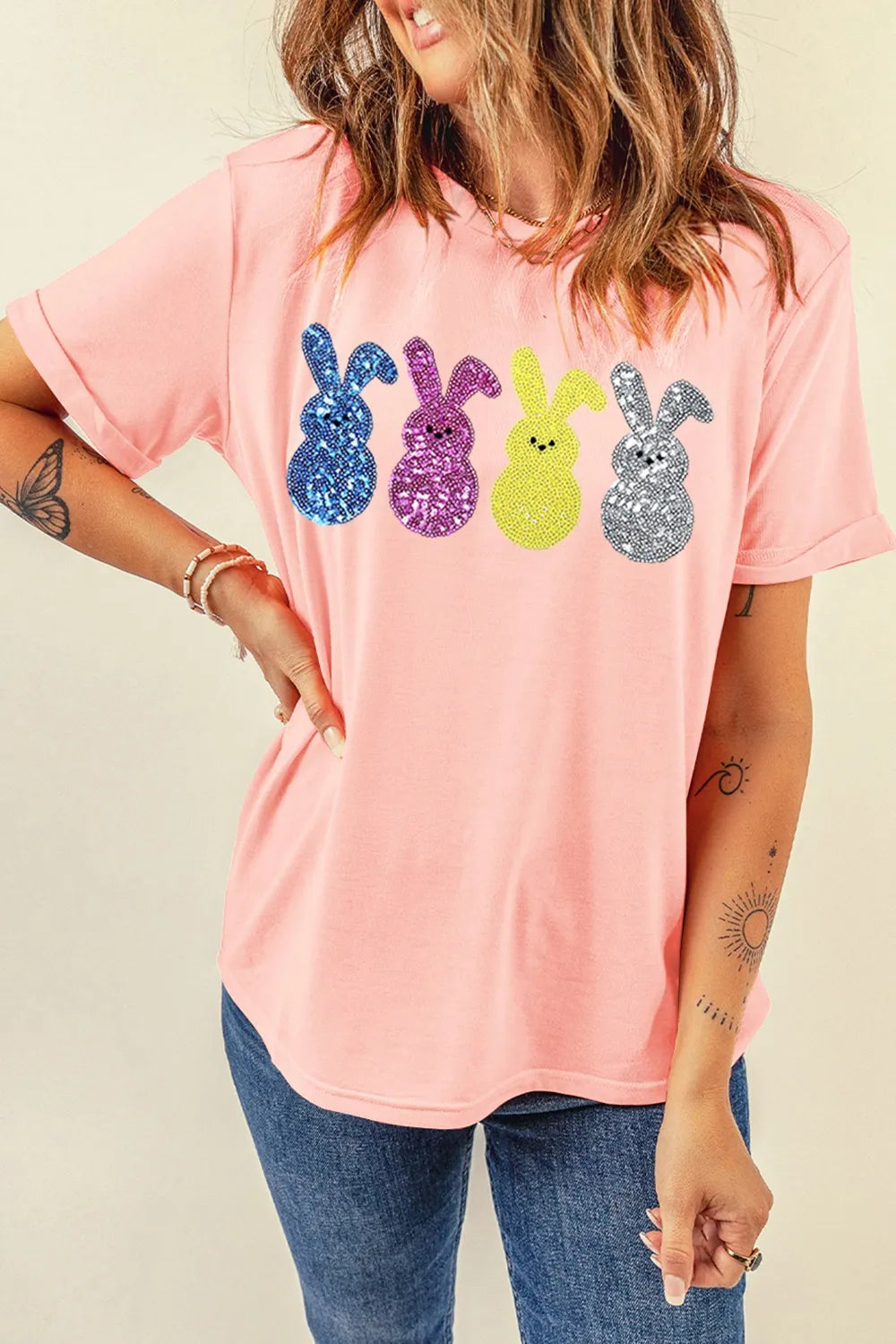 Pink sequin bunny t-shirt with colorful glitter rabbits, relaxed fit, soft cotton texture.