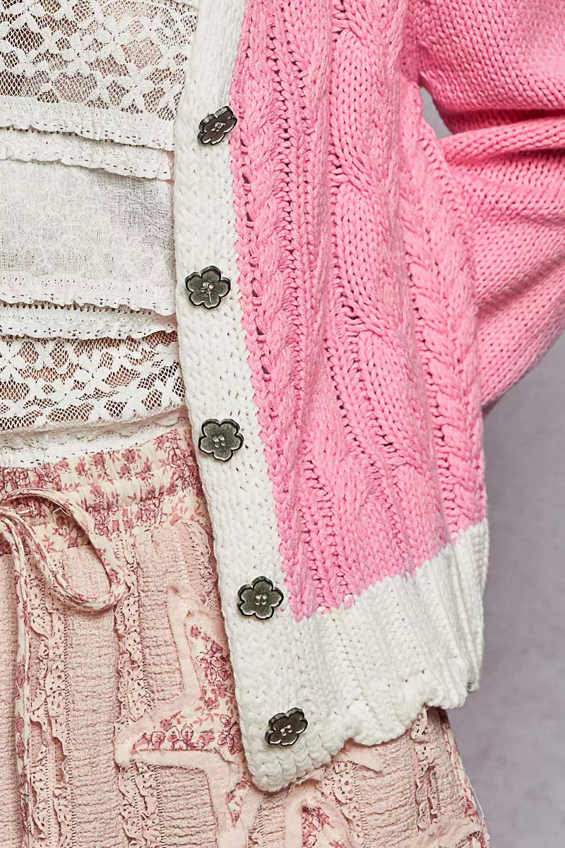 Pink cardigan with contrast border details and buttoned front