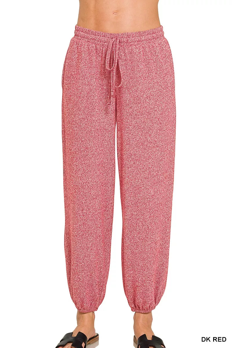 Deep red drawstring joggers with elastic waistband and cuffed hem