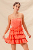 Burnt orange dress showcasing layered ruffle texture