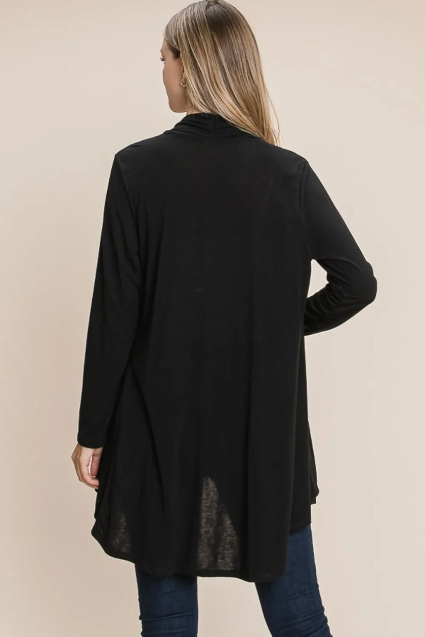 Soft knit charcoal cardigan layered over white top