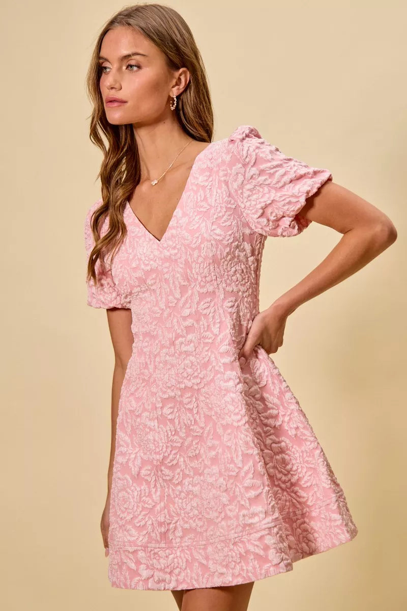 Close-up of floral jacquard fabric on fit-and-flare mini dress