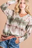 Stretchy tie-dye V-neck top with muted green-brown ombré blobs over off-white, cozy casual fit