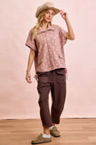 Close detail of terry fabric on relaxed wide-leg pants