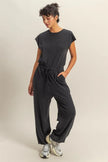 Charcoal black jumpsuit showcasing subtle keyhole back detail