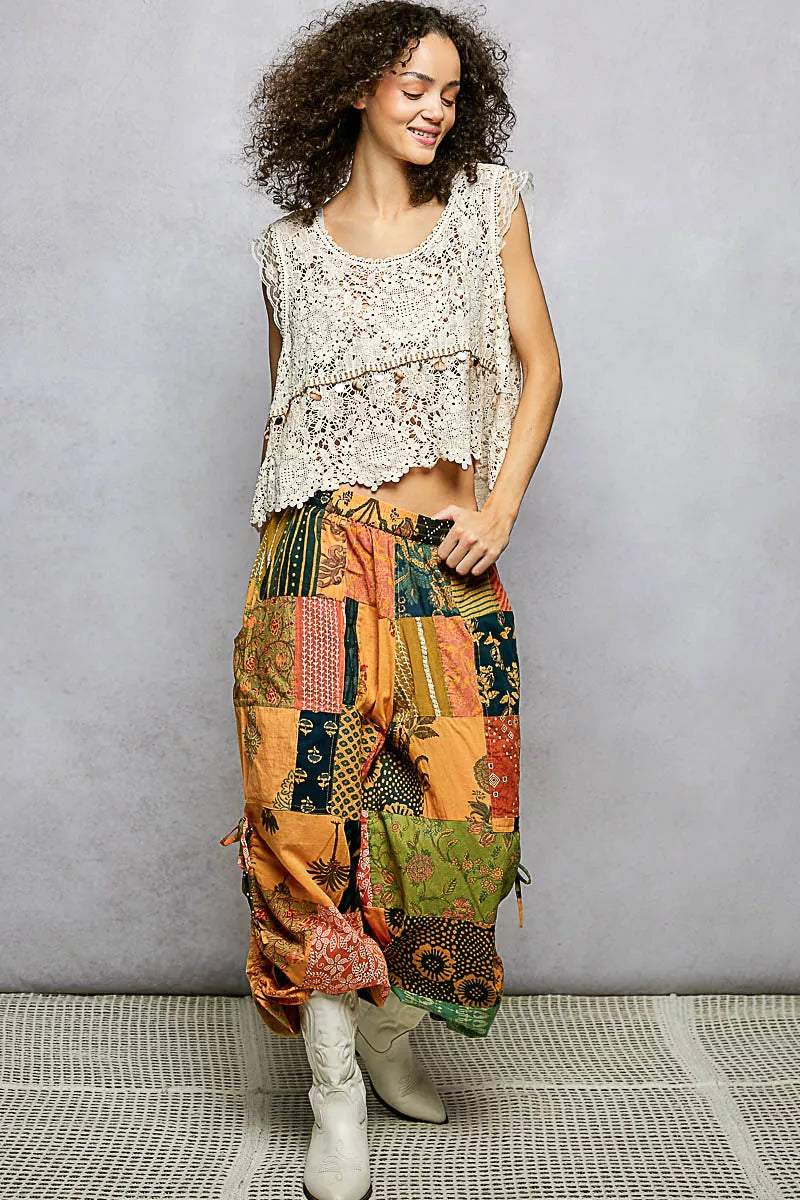 Multicolor patchwork wide leg pants with earthy prints and adjustable drawstring waist