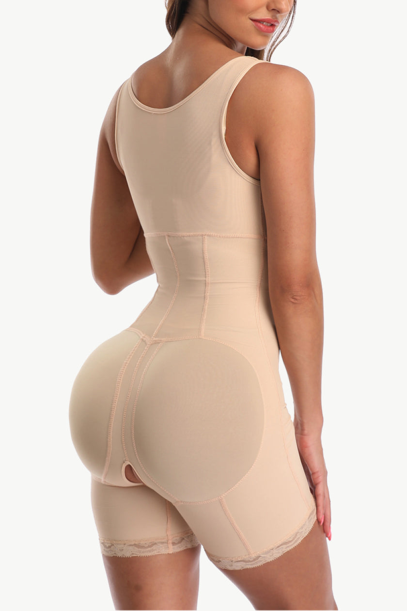 Slightly stretched lace zip-up shaper showing body shaping