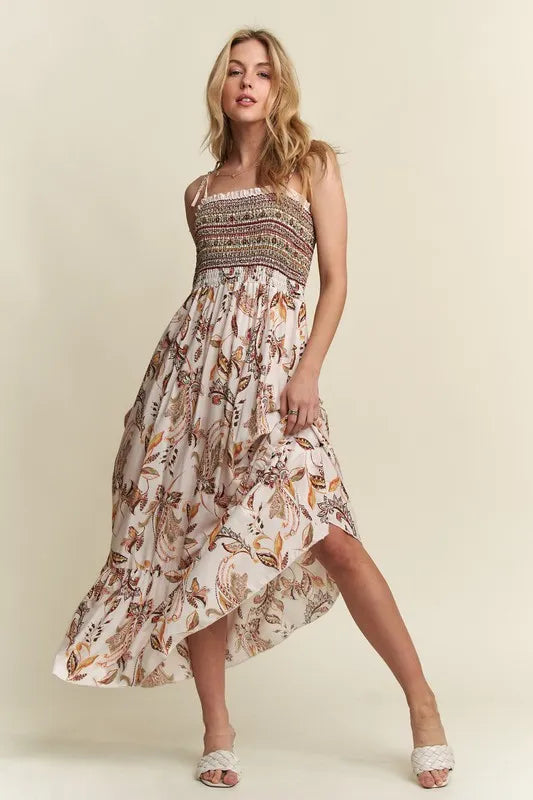 Printed rayon dress with adjustable tie shoulders and smocked details