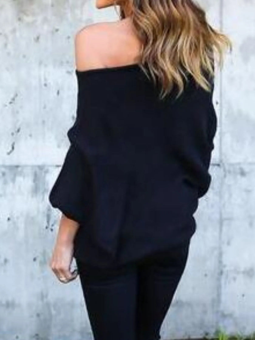 Ribbed knit top draped over arm highlighting soft and breathable fabric