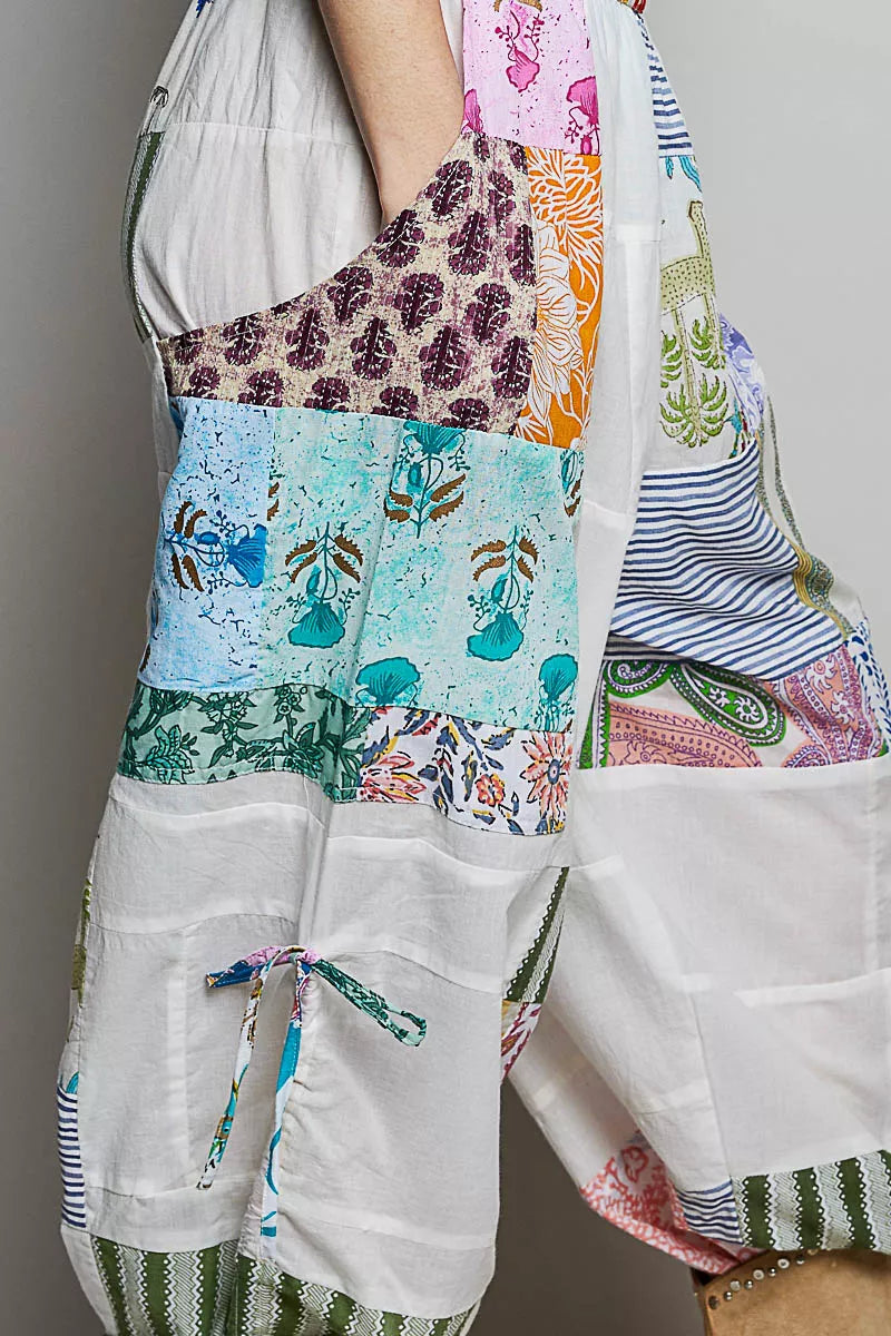 Multi colored patchwork wide leg cotton pants with adjustable side drawstrings and prints
