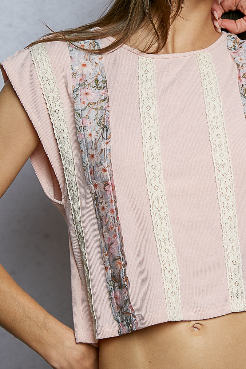 Pink ribbed cropped top with floral patch and lace trim details