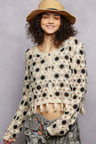 Cream and black floral crochet cardigan with tassel hem, loose fit, textured openwork design