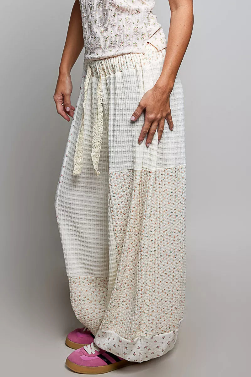 White patchwork mixed knit balloon pants with floral print and lace drawstring detail
