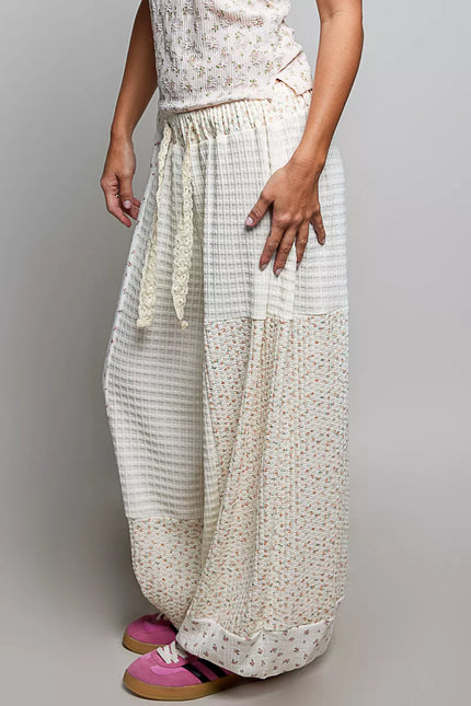White patchwork mixed knit balloon pants with floral print and lace drawstring detail