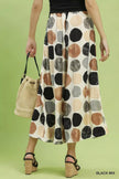 Women's beige wide leg flowy trousers with multi colored dot print and elastic waist