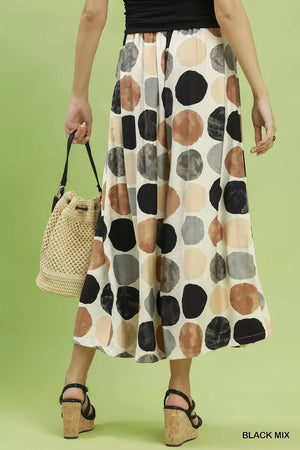 Women's beige wide leg flowy trousers with multi colored dot print and elastic waist