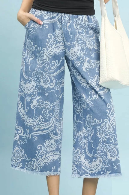 Blue stone wash denim wide leg crop pants with white floral print frayed hem