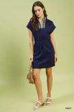 Trendy navy blue dolman-sleeve rayon-polyester dress with zip collar, relaxed fit, and woven handbag detail