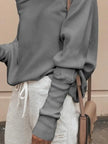 Oversized ribbed knit top with loose fit and breathable fabric