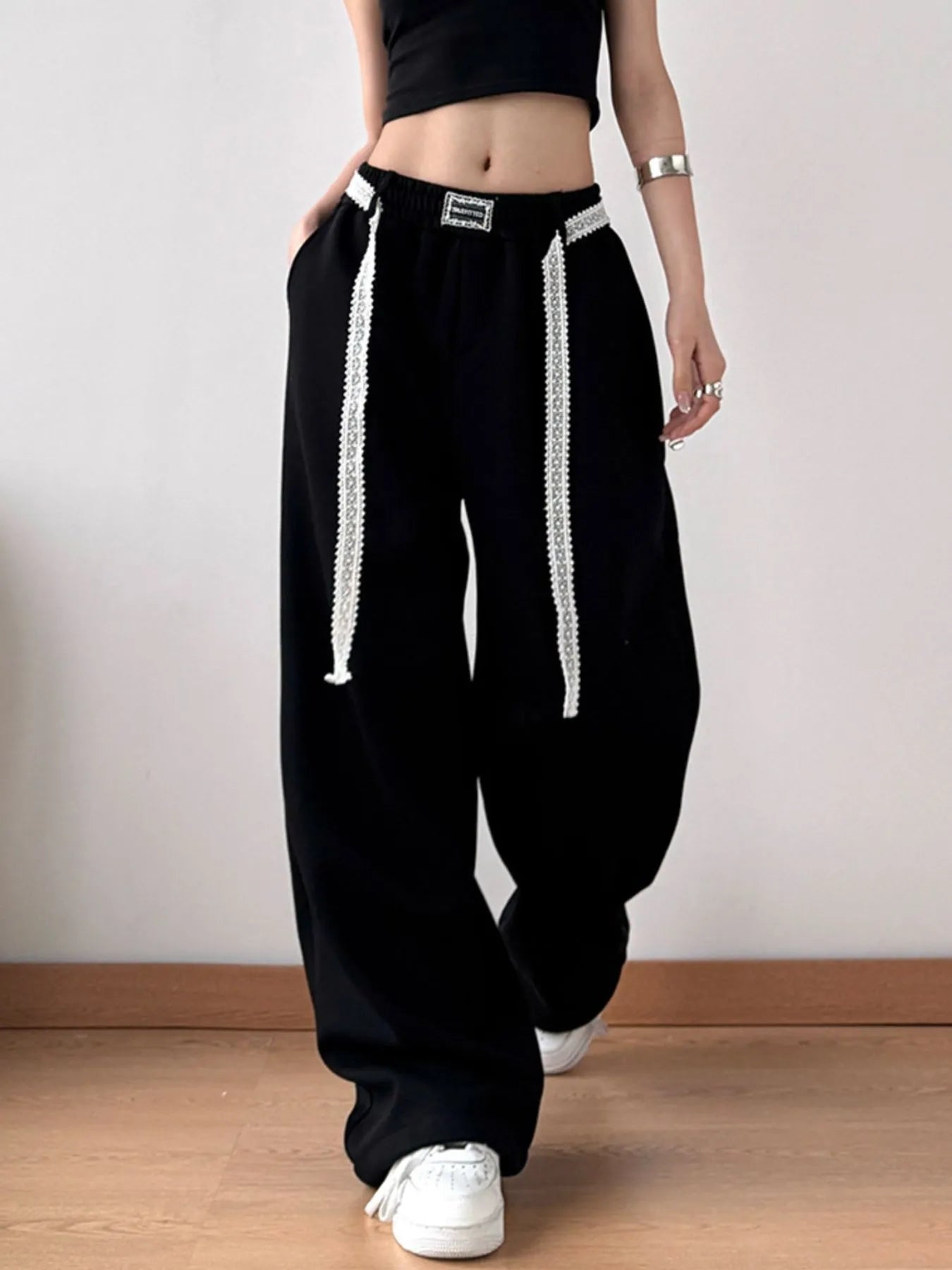 Front view of wide-leg pants with visible pocket design