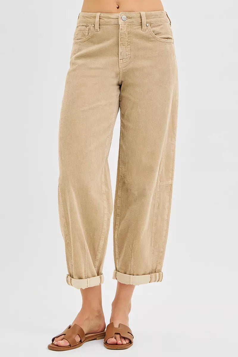 Model wearing retro-inspired high-rise corduroy pants