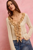 Cream and beige pointelle knit cardigan with ruffled front tie and long sleeves