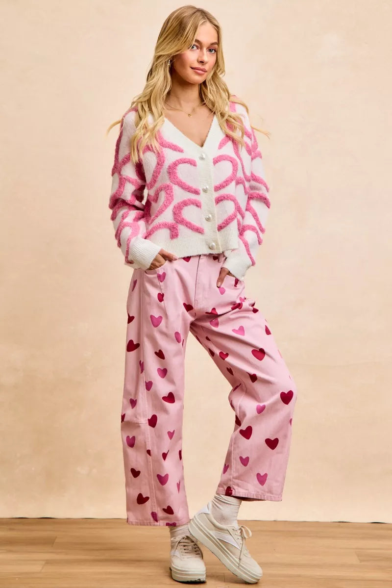Pink textured heart cardigan with pearl buttons, cozy knit, loose fit, V-neck style