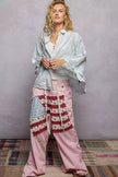 Elegant floral embroidered shirt featuring scalloped collar trim