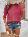white blouse with airy fabric and elaborate eyelet lace detail on front