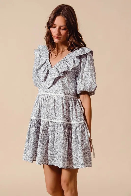White and gray floral cotton dress with ruffled neckline and side tie waist