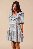 White and gray floral cotton dress with ruffled neckline and side tie waist
