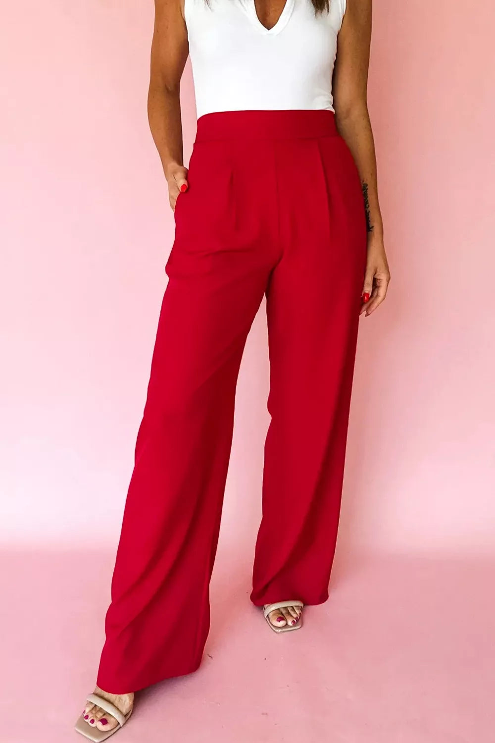Light gray pleated straight leg pants with relaxed fit