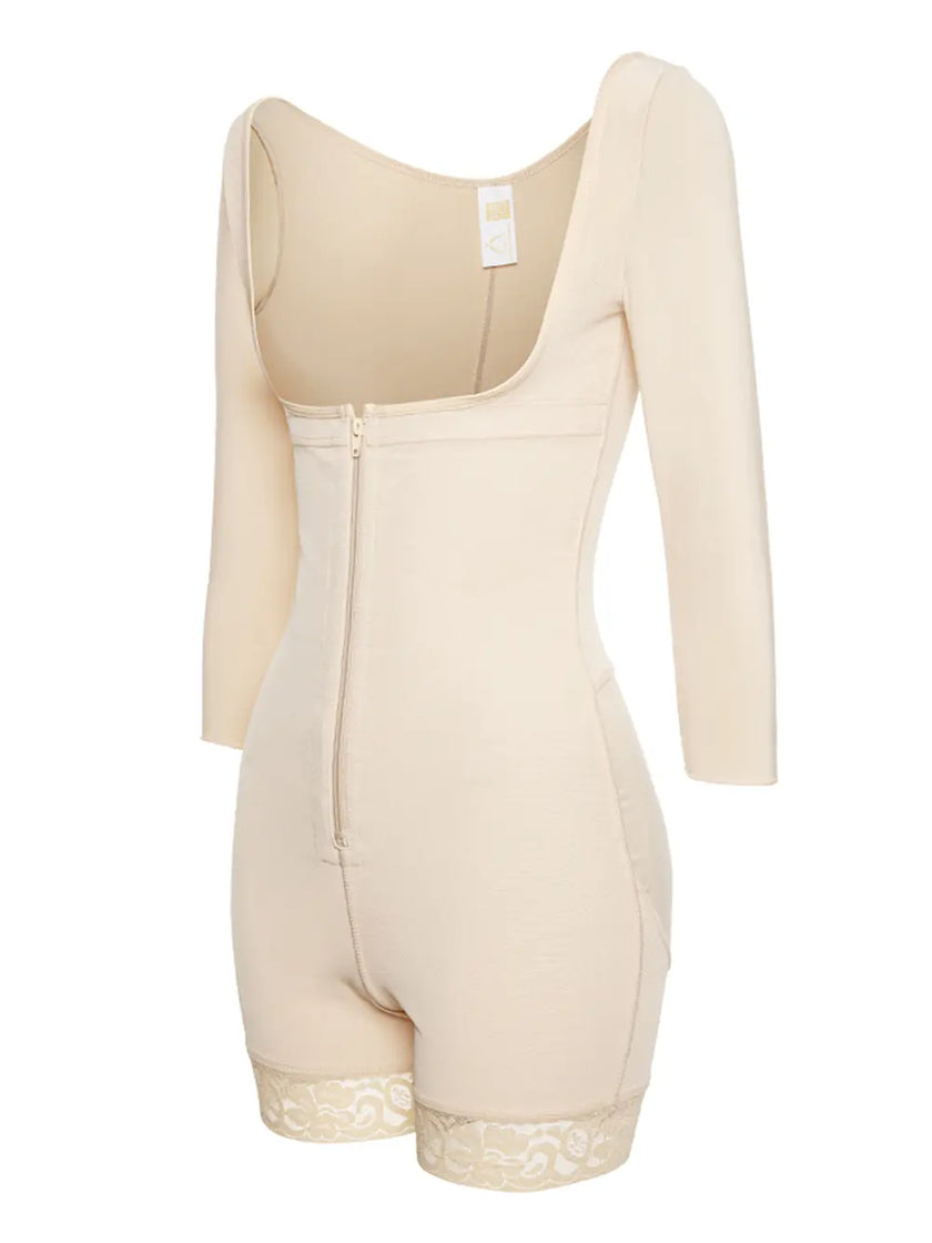 Light pink long sleeve top with subtle ruffle accents around collar