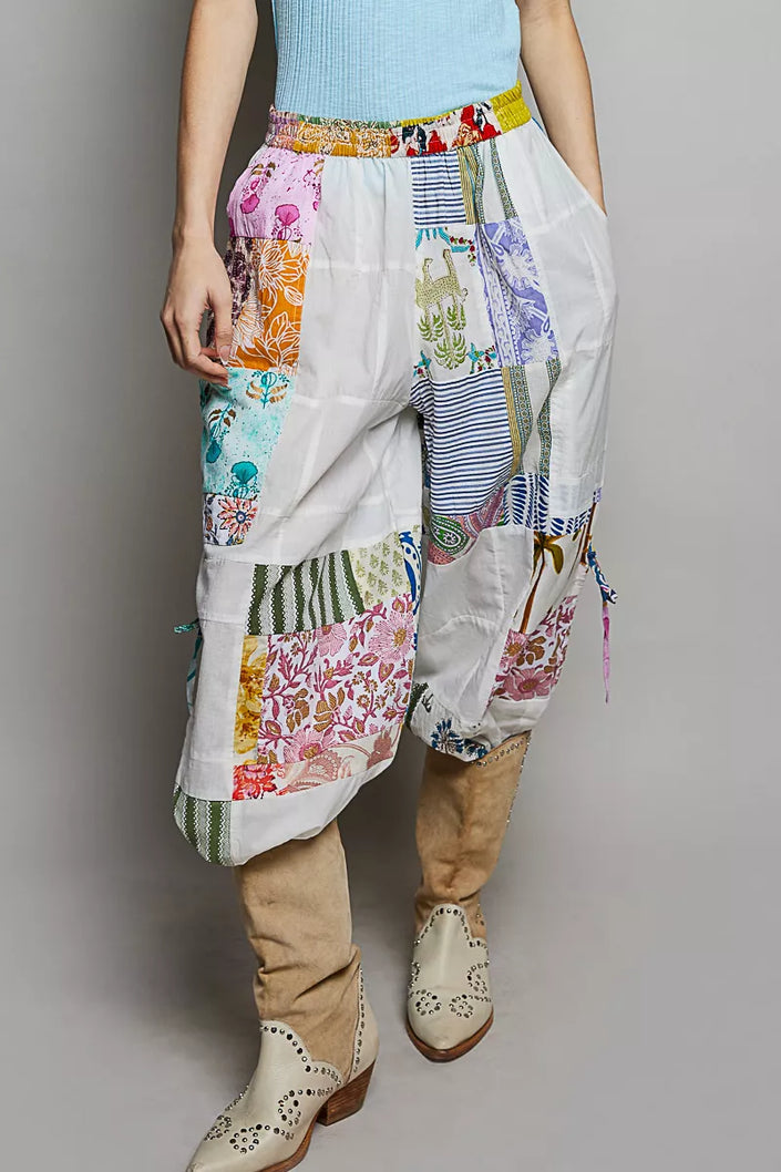 Multi-colored patchwork wide leg cotton pants with floral prints and adjustable side drawstrings