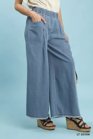 Light blue stone washed cotton wide leg pants with elastic waist and frayed hems