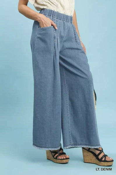 Light blue stone washed cotton wide leg pants with elastic waist and frayed hems