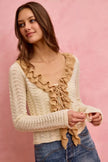 Cream and beige pointelle knit cardigan with ruffled trim and tie detail