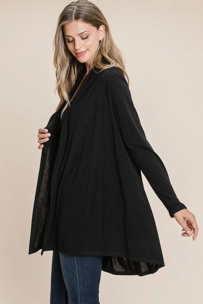 Close-up of open-front cardigan sleeve detail in charcoal
