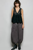 Black scalloped lace top with deep V-neck and tiered ruffle detailing sleeveless design