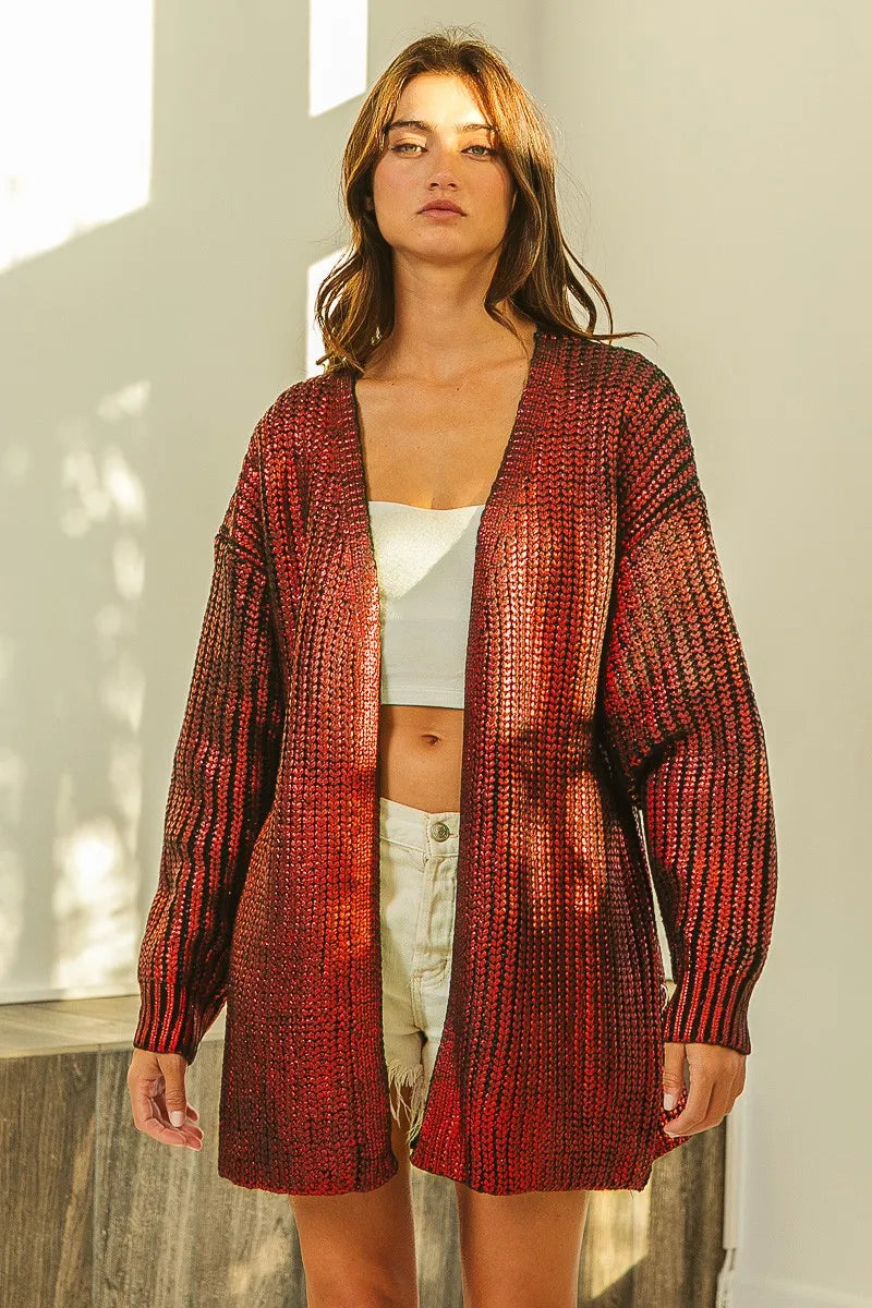 Red metallic knit V-neck cardigan with shimmering texture, loose fit, open front.