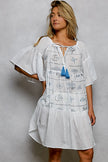 White square neck mini dress with blue embroidery, tassel tie, and half flared sleeves.