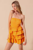 Mini dress featuring ruffled layers and strapless design