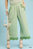 Sage green scallop hem wide-leg pants with vertical pinstripes