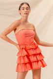 Burnt orange dress with detailed ruffle accents