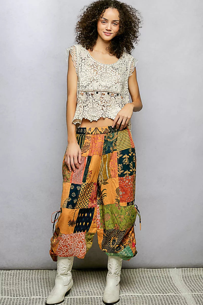 Multi colored patchwork wide leg bohemian pants with adjustable drawstring and loose fit