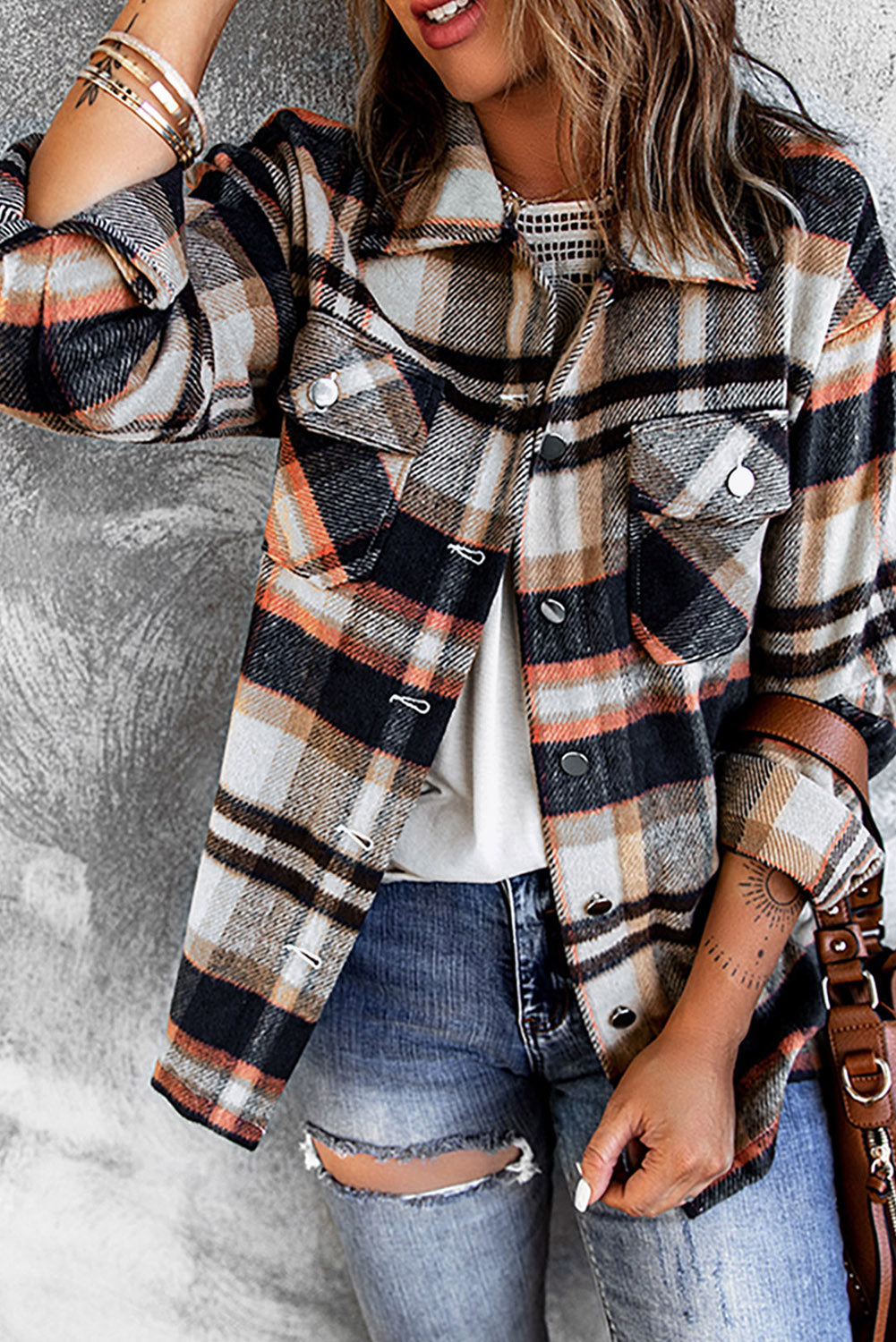 Back view of plaid shirt jacket showing straight hem and dropped shoulder seams