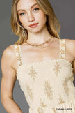 Cropped ankle-length floral jumpsuit in warm cream tones