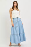 High rise light wash blue denim tiered maxi skirt with button front closure