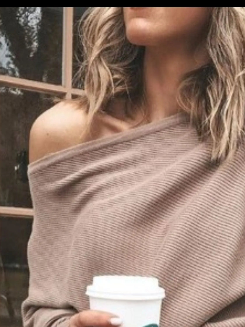 Ribbed knit top with subtle vertical pattern and soft texture