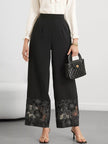 Elegant wide leg pants featuring lace hem detail